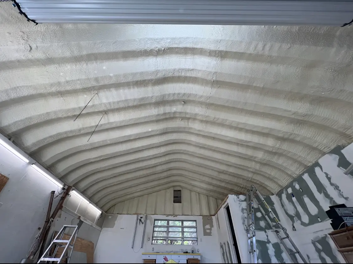 Spray polyurethane foam applied to the underside of a metal roof deck in Ripon